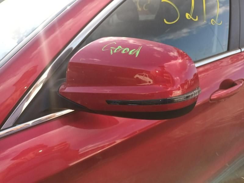 A Red Car With the Word Good Written on the Side Mirror — South West 4WD Wreckers In Brisbane, QLD