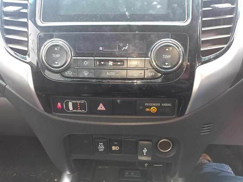 A Person is Sitting in the Driver 's Seat of a Car— South West 4WD Wreckers In Brisbane, QLD