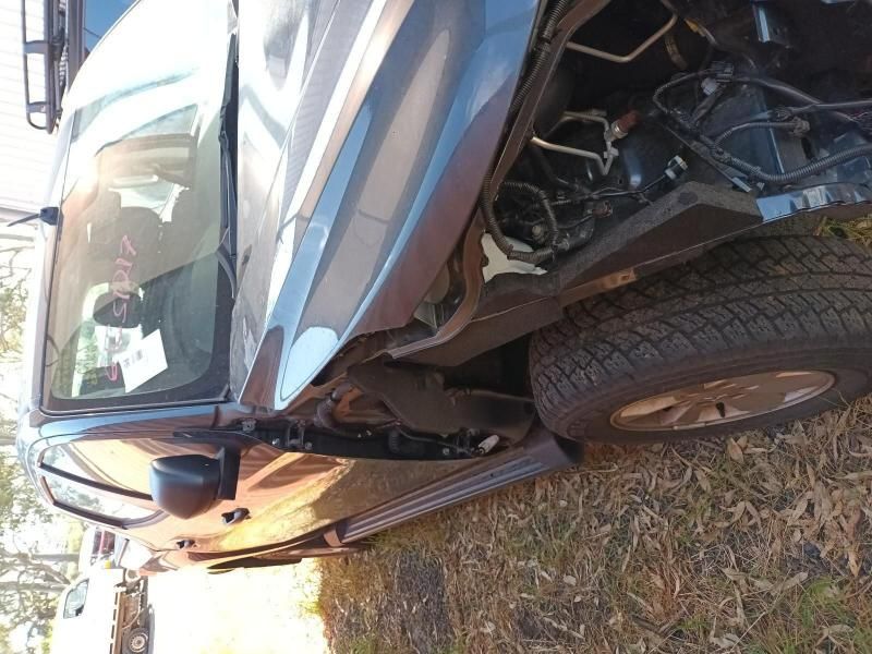 A Car That Has Been Damaged and is Sitting in the Grass — South West 4WD Wreckers In Harristown, QLD
