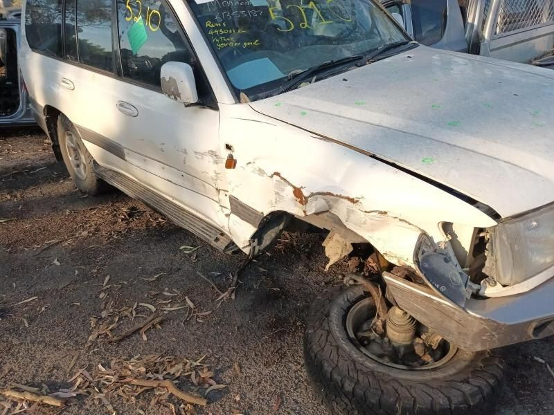 A White Car With a Damaged Front End is Parked on the Ground — South West 4WD Wreckers In Harristown, QLD