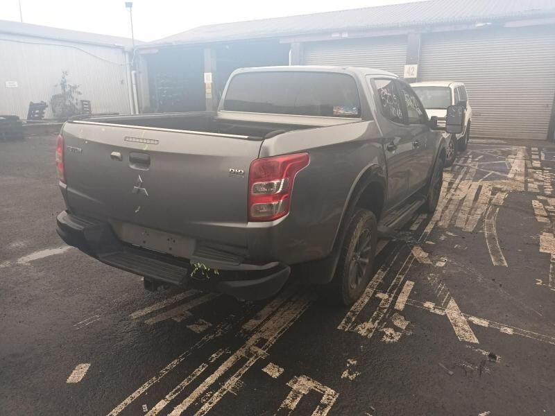 A Gray Truck is Parked in a Parking Lot in Front of a Building — South West 4WD Wreckers In Brisbane, QLD
