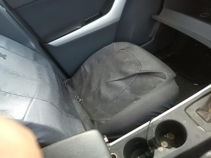 A Car With a Broken Seat and a Cup Holder — South West 4WD Wreckers In Harristown, QLD
