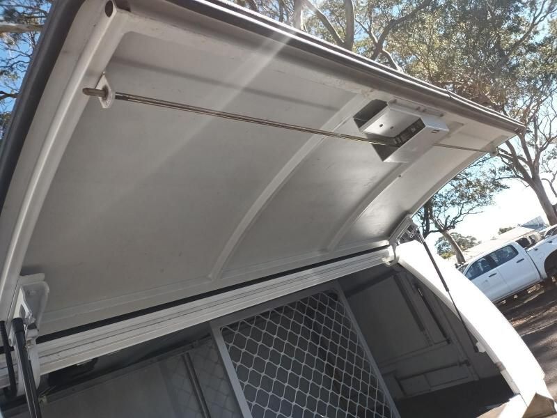 The Roof of a White Truck With the Door Open — South West 4WD Wreckers In Harristown, QLD