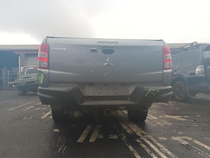 A Mitsubishi Triton Pickup Truck is Parked in a Parking Lot — South West 4WD Wreckers In Brisbane, QLD