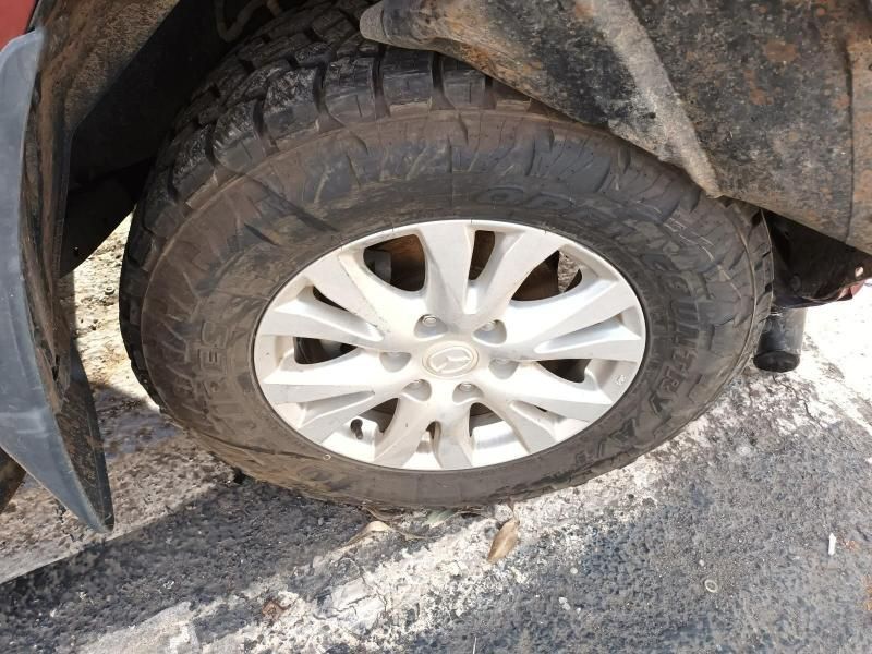 A Close Up of a Car Tire on a Dirt Road — South West 4WD Wreckers In Harristown, QLD