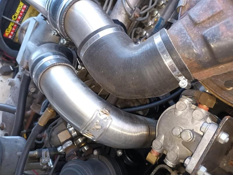 A Close Up of a Car Engine With a Battery in the Background — South West 4WD Wreckers In Brisbane, QLD