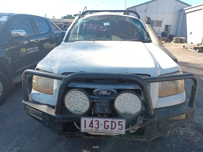 A White Ford Truck With a License Plate That Says 143 Gd5 — South West 4WD Wreckers In Harristown, QLD