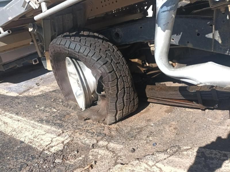 A Truck With a Flat Tire on the Ground — South West 4WD Wreckers In Harristown, QLD