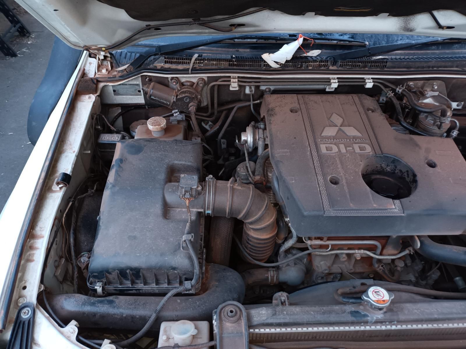 The Engine of a Mitsubishi is Shown With the Hood Open — South West 4WD Wreckers In Brisbane, QLD