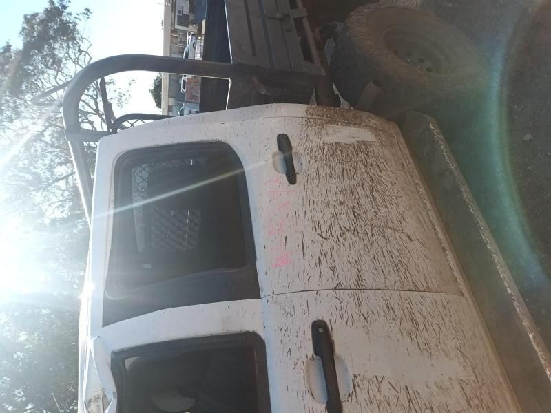 A Dirty White Truck is Parked on the Side of the Road — South West 4WD Wreckers In Harristown, QLD