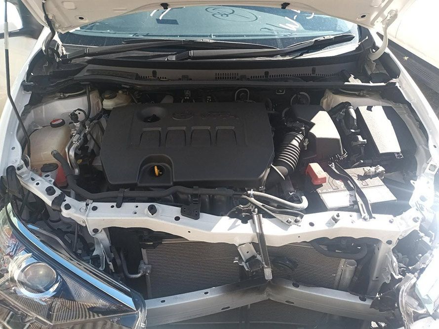 The Engine of a White Car is Shown with the Hood Up — South West 4WD Wreckers in Harristown, QLD
