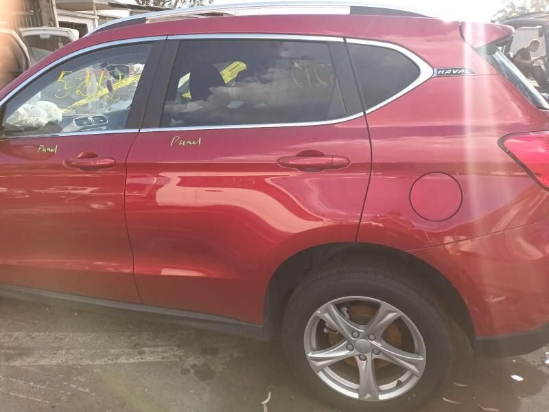 A Red Car is Parked on the Side of the Road — South West 4WD Wreckers In Brisbane, QLD