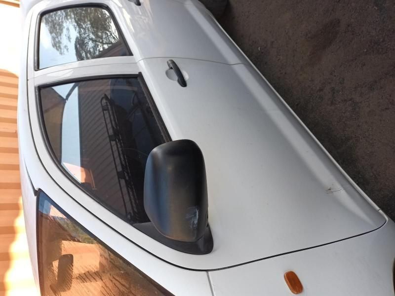 A White Van is Parked on the Side of the Road — South West 4WD Wreckers In Harristown, QLD