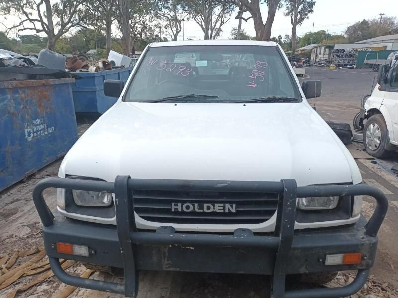 A White Holden Truck is Parked in a Parking Lot — South West 4WD Wreckers In Harristown, QLD