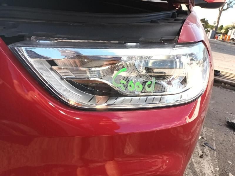 A Close Up of a Red Car 's Headlight With the Hood Open — South West 4WD Wreckers In Brisbane, QLD