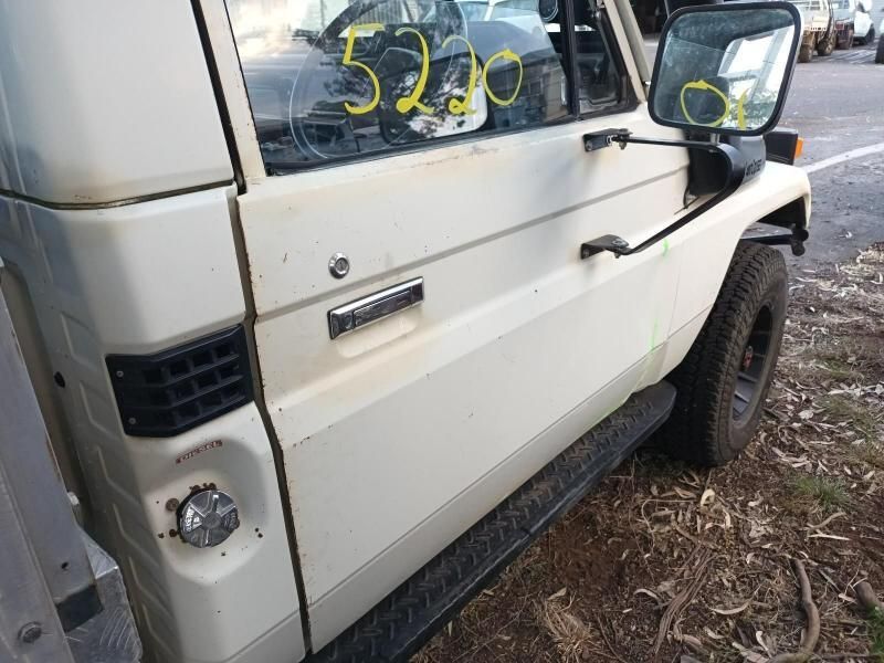 A White Truck is Parked on the Side of the Road — South West 4WD Wreckers In Brisbane, QLD
