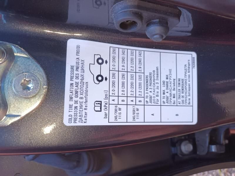 A Close Up of a Tire Pressure Label on a Car — South West 4WD Wreckers In Harristown, QLD