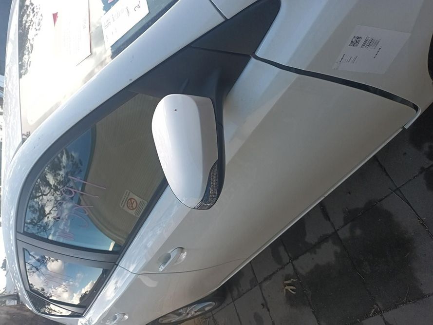 A White Car is Parked on the Side of the Road — South West 4WD Wreckers in Harristown, QLD