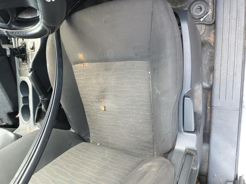 A Dirty Car Seat With a Steering Wheel in the Background — South West 4WD Wreckers In Brisbane, QLD
