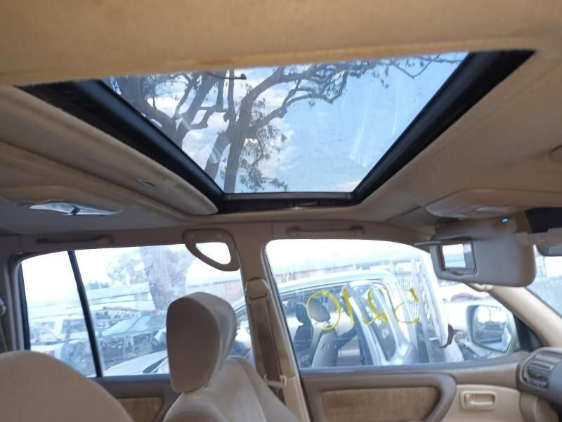 A Car With a Sunroof and a Tree in the Background — South West 4WD Wreckers In Harristown, QLD