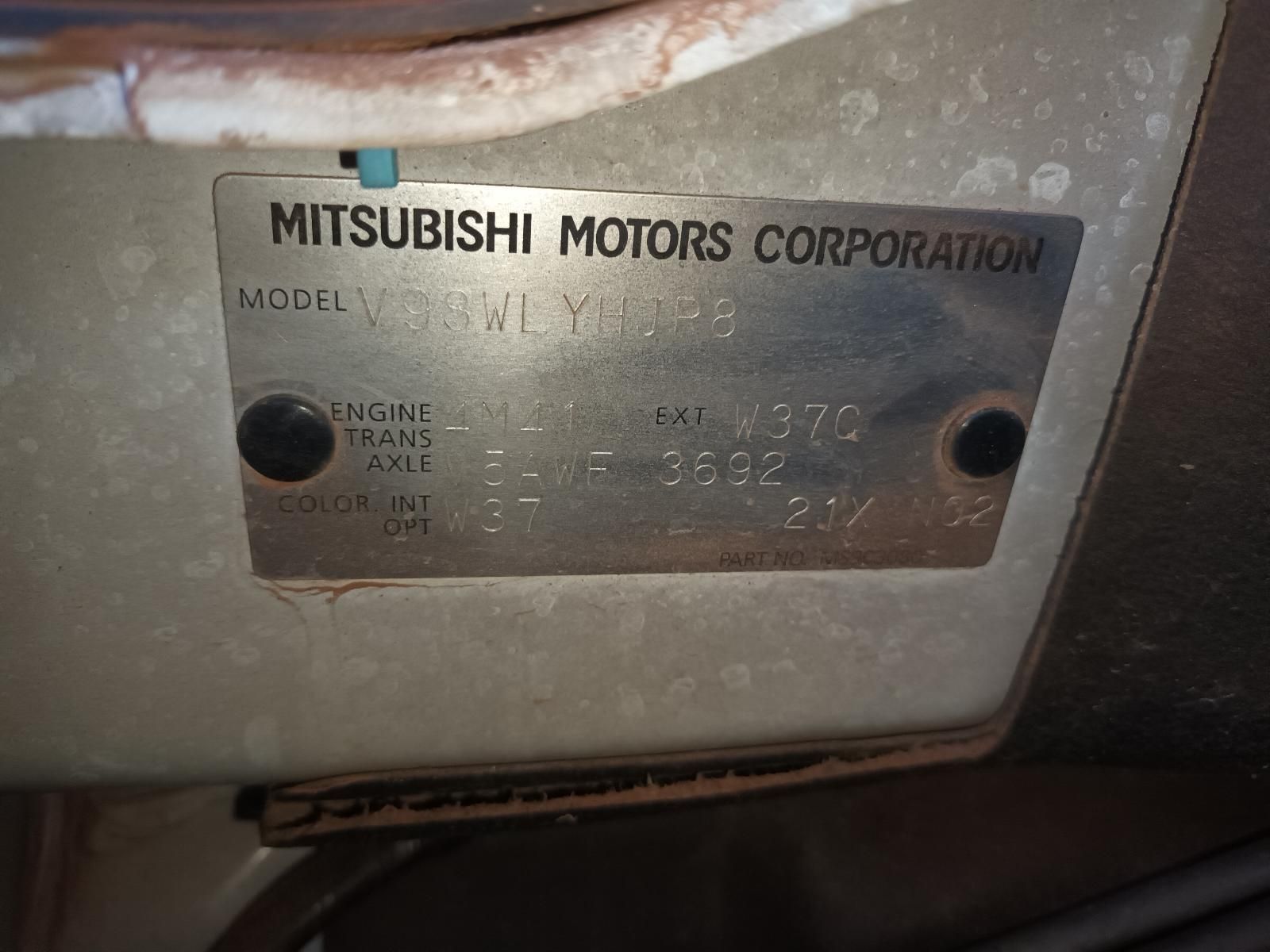 A Close Up of a Mitsubishi Motors Corporation License Plate — South West 4WD Wreckers In Brisbane, QLD