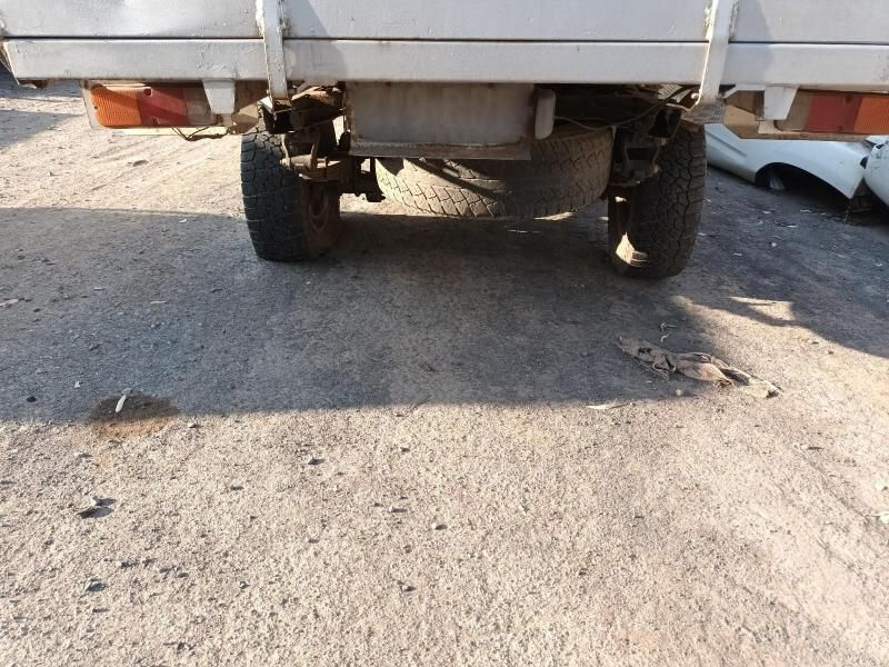 A White Truck is Parked on the Side of the Road — South West 4WD Wreckers In Harristown, QLD