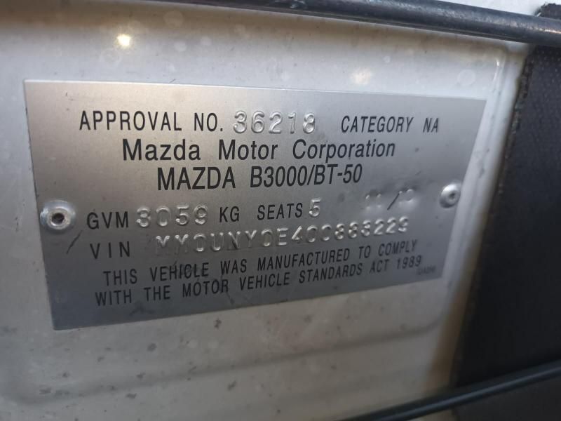 A Close Up of a Mazda B3000 / Bt-50 License Plate — South West 4WD Wreckers In Harristown, QLD