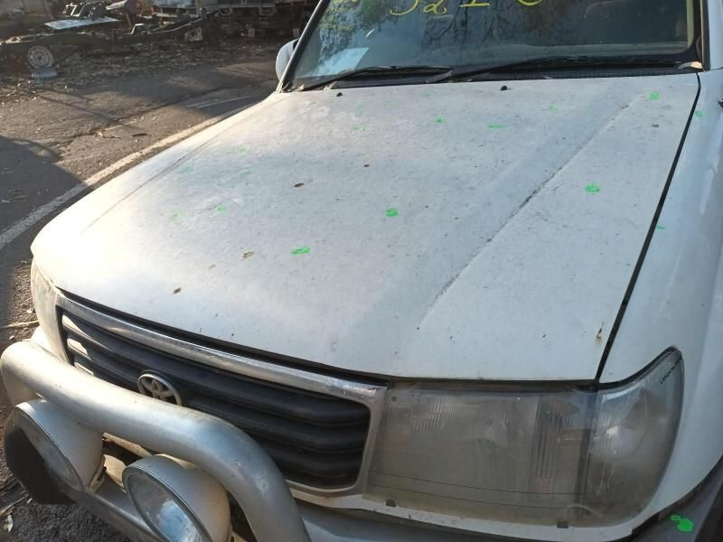 A White Toyota Truck is Parked in a Parking Lot — South West 4WD Wreckers In Harristown, QLD