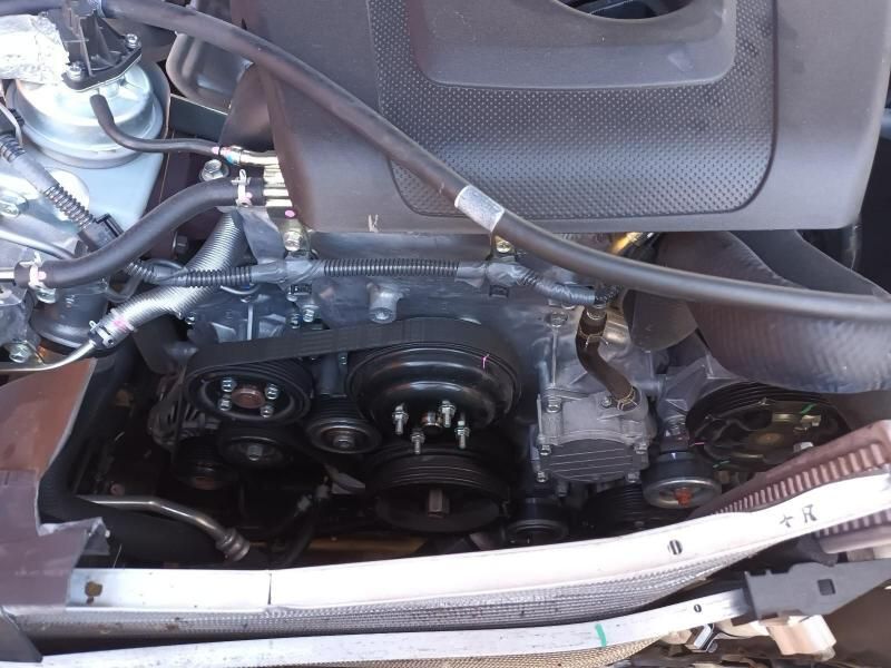 A Close Up of a Car Engine With a Belt on It — South West 4WD Wreckers In Harristown, QLD