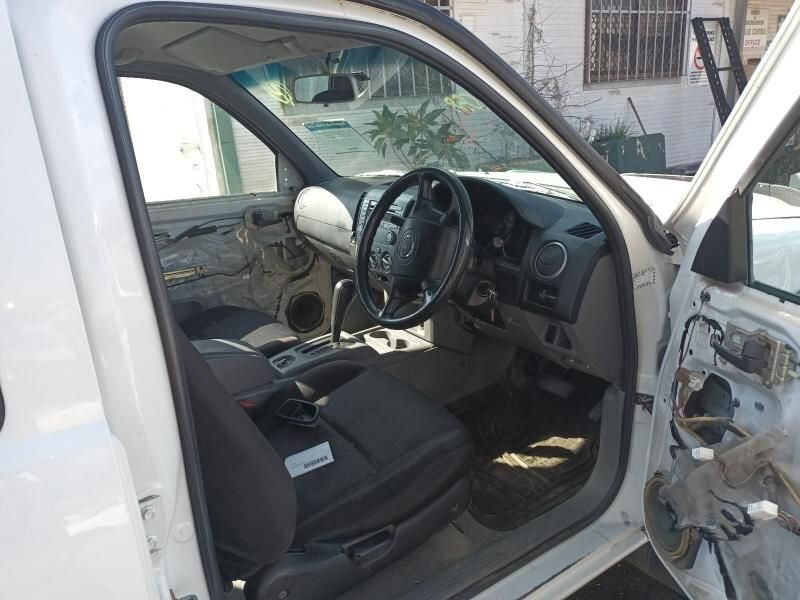 The Inside of a White Car With the Door Open — South West 4WD Wreckers In Harristown, QLD