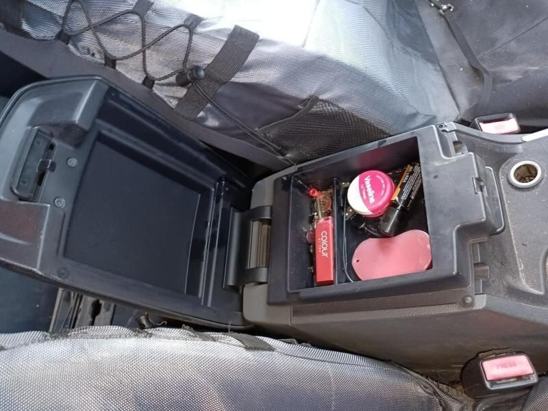 A Car Console With a Bottle of Lotion in It — South West 4WD Wreckers In Harristown, QLD