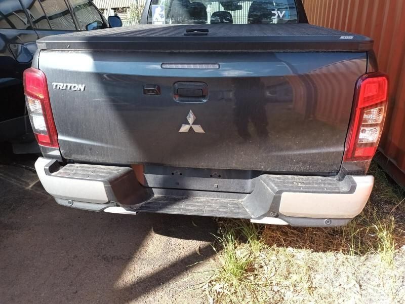 The Back End of a Mitsubishi Triton Truck is Shown — South West 4WD Wreckers In Harristown, QLD