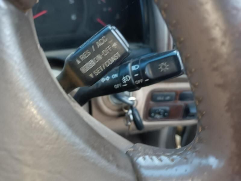 A Close Up of a Car Steering Wheel With a Switch That Says a Res / Acc — South West 4WD Wreckers In Harristown, QLD