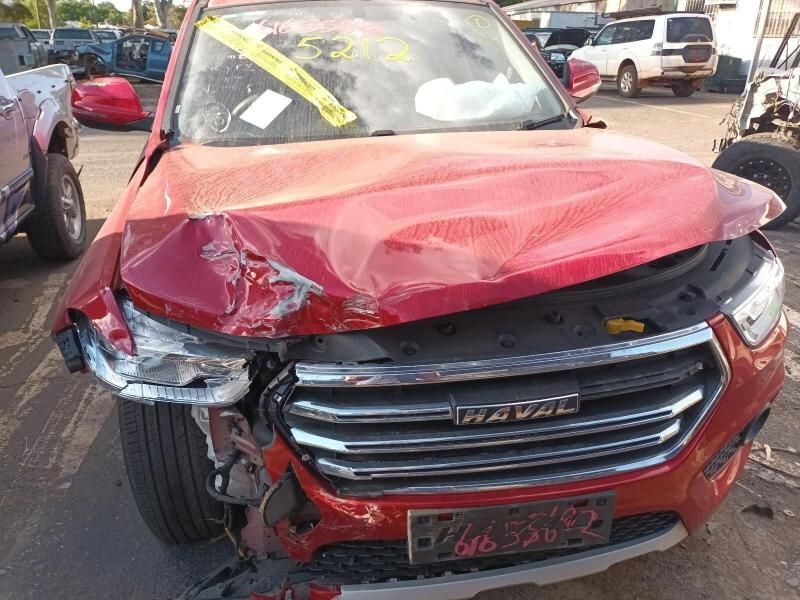 A Red Car With a Damaged Hood is Parked in a Parking Lot — South West 4WD Wreckers In Brisbane, QLD