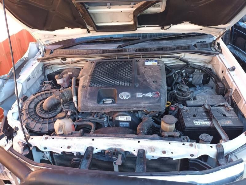 The Engine of a White Car is Shown With the Hood Open — South West 4WD Wreckers In Harristown, QLD