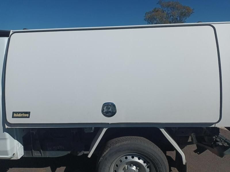 A White Truck With a White Canopy is Parked on the Side of the Road — South West 4WD Wreckers In Harristown, QLD