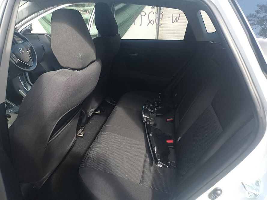 The Back Seat of a White Car with a Black Seat Cover — South West 4WD Wreckers in Harristown, QLD