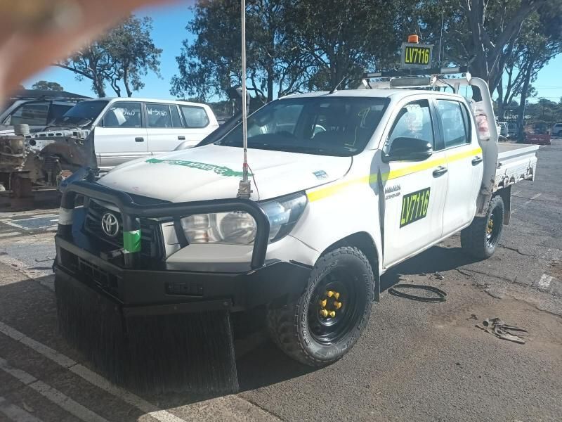 A White Truck is Parked on the Side of the Road — South West 4WD Wreckers In Brisbane, QLD