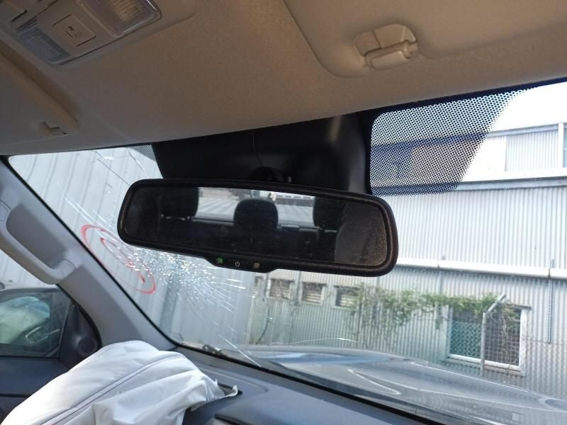 A Car With a Rear View Mirror is Parked in Front of a Building — South West 4WD Wreckers In Harristown, QLD