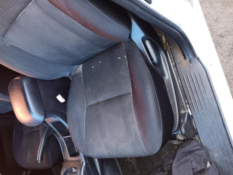 A White Car With a Black Seat and Arm Rest — South West 4WD Wreckers In Harristown, QLD