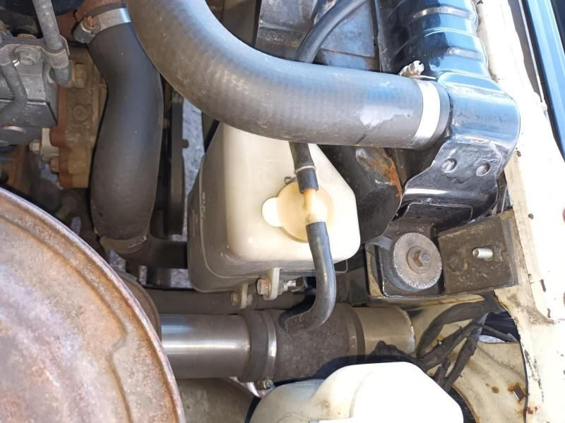 A Close Up of a Car Engine With a Hose Attached to It — South West 4WD Wreckers In Brisbane, QLD