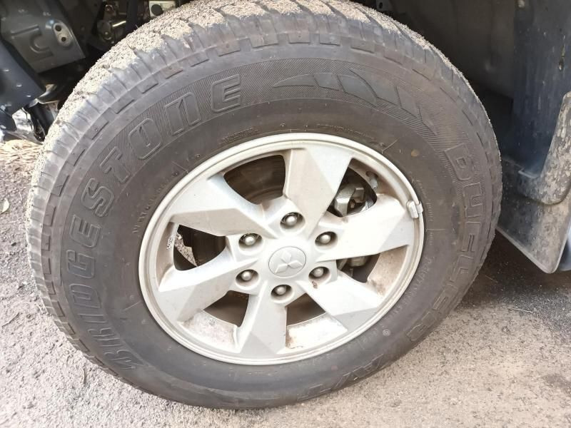 A Close Up of a Tire on a Car That Says Bridgestone — South West 4WD Wreckers In Harristown, QLD