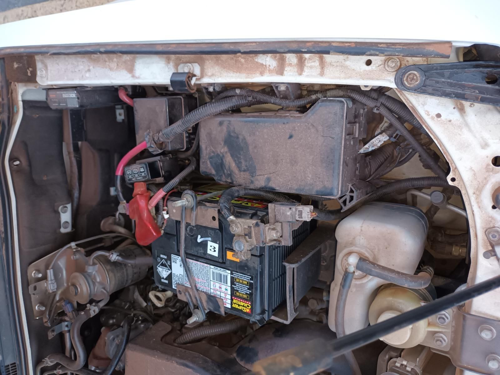 A Close Up of a Car Engine With a Battery in It — South West 4WD Wreckers In Brisbane, QLD