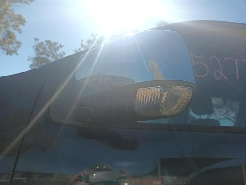 The Sun is Shining Through the Rear View Mirror of a Car — South West 4WD Wreckers In Harristown, QLD