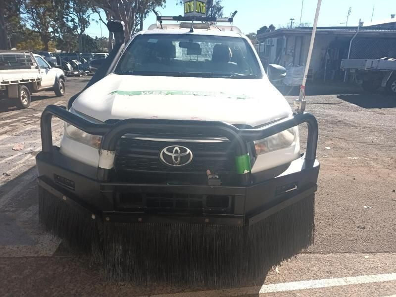 A White Toyota Truck is Parked in a Parking Lot — South West 4WD Wreckers In Brisbane, QLD
