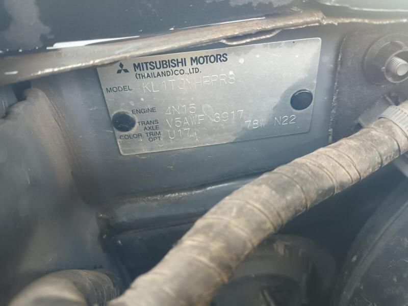 A Close Up of a Mitsubishi Motors License Plate on a Car — South West 4WD Wreckers In Brisbane, QLD