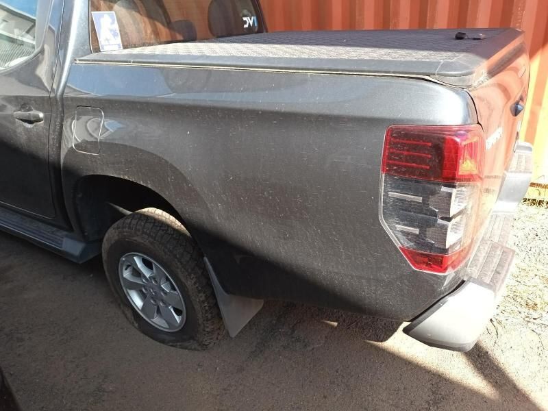 A Gray Truck is Parked in Front of an Orange Container — South West 4WD Wreckers In Harristown, QLD