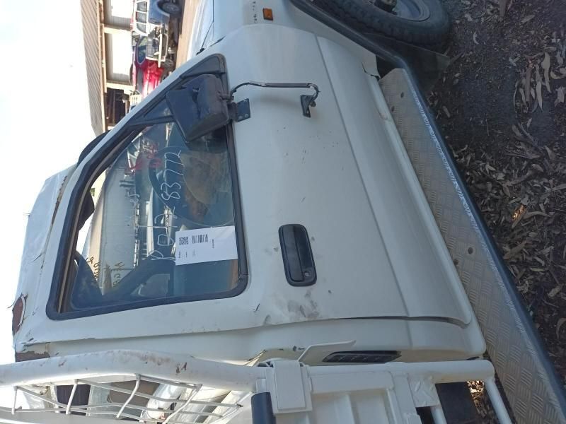 A White Truck is Parked on the Side of the Road — South West 4WD Wreckers In Brisbane, QLD
