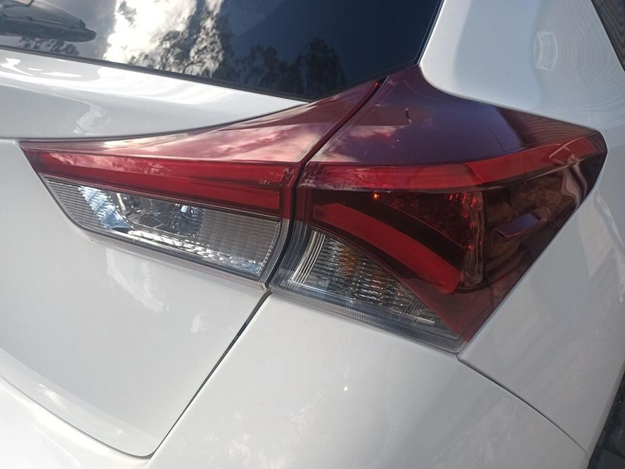 A Close Up of a White Car's Tail Light — South West 4WD Wreckers in Harristown, QLD