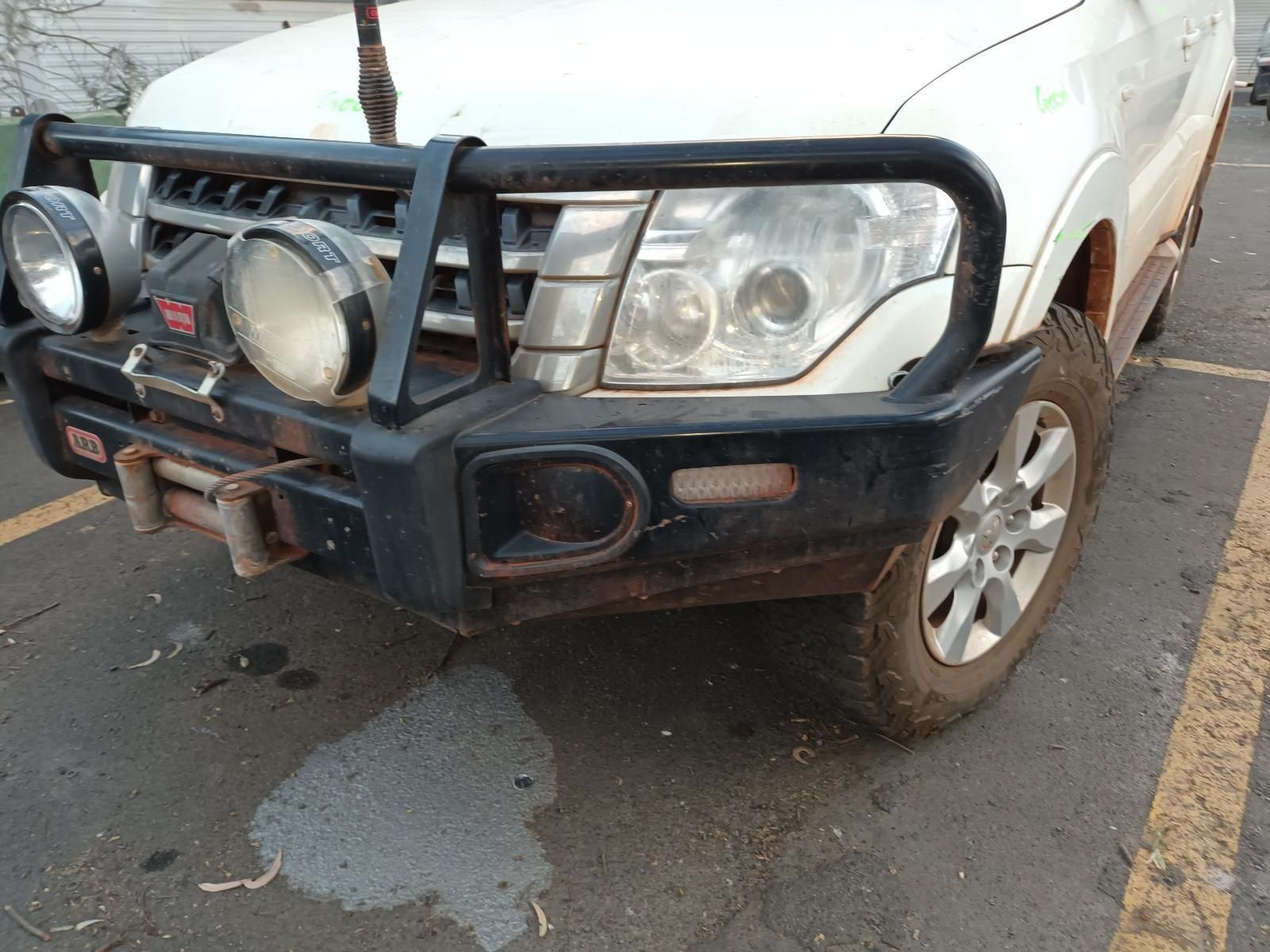 A White Truck With a Black Bumper is Parked in a Parking Lot — South West 4WD Wreckers In Brisbane, QLD